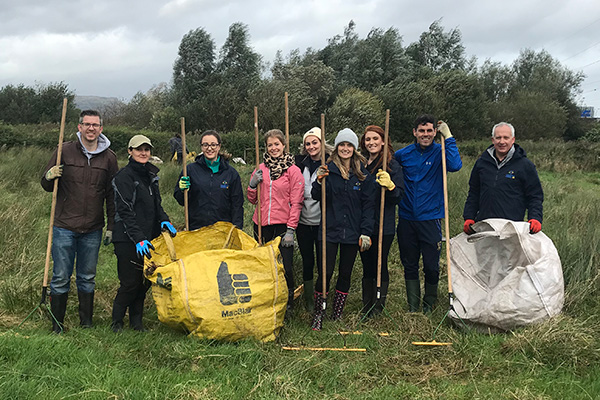 Allstate Ni employees volunteering at a nature center. 