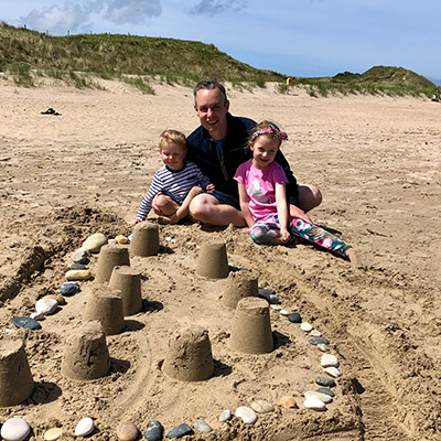 Brian with his childern at the beach. 