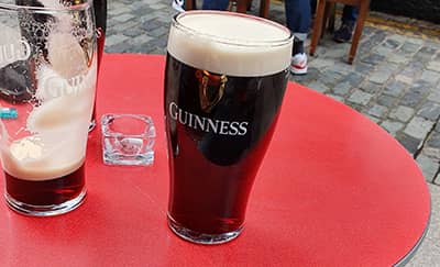 Guinnes on a table near Cathedral Quarter. 