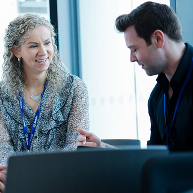 A couple of employees working together. 