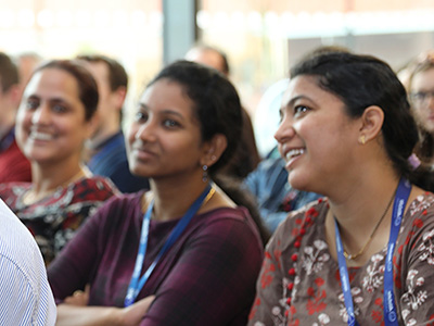 Employees sitting in a meeting. 