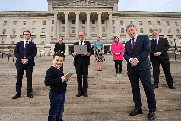Jamie Campbell stands with businessmen in the community.